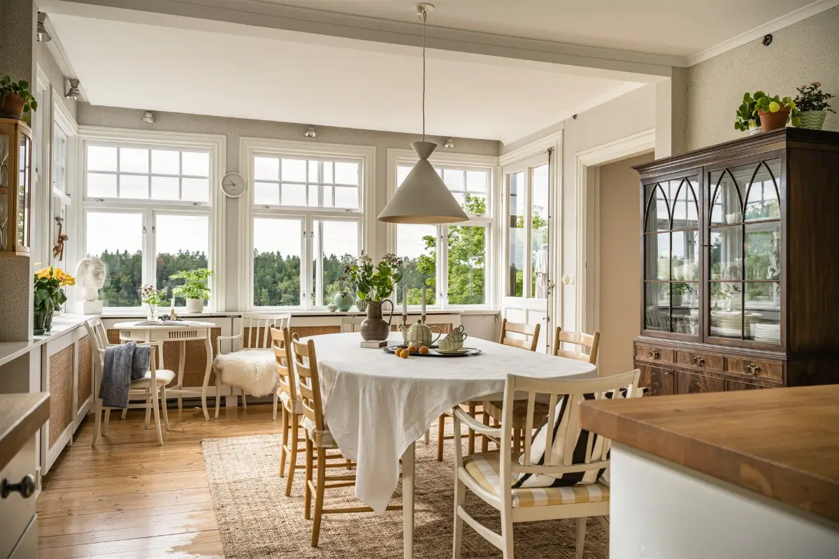 A Cozy Early 20th-Century Home with Views of Lake Mälaren in Sweden 8 open-plan kitchen dining room large windows