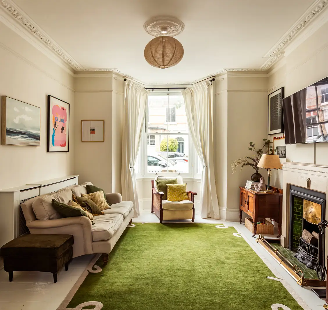 front living room bay window fireplace green rug
