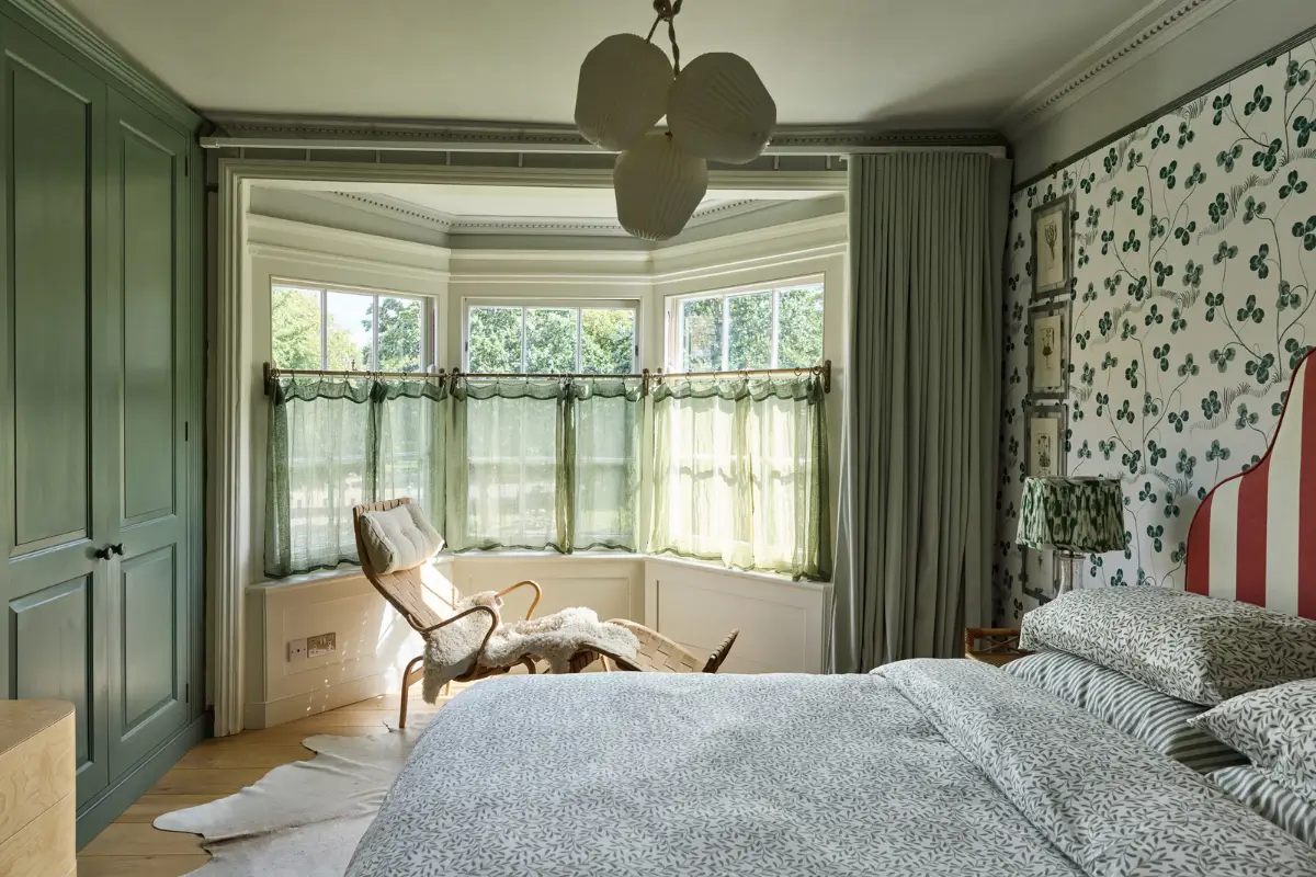 A deVOL Kitchen in a Beautiful Restored Georgian Townhouse in London 23 green bedroom bay window clover wallpaper red striped headboard nordroom