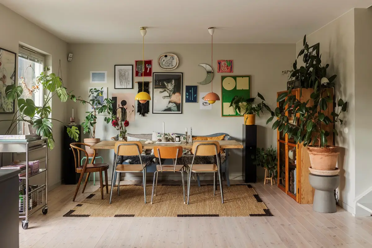 A Charming 1960s Family Home in Stockholm 1 kitchen table vintage chairs gallery wall