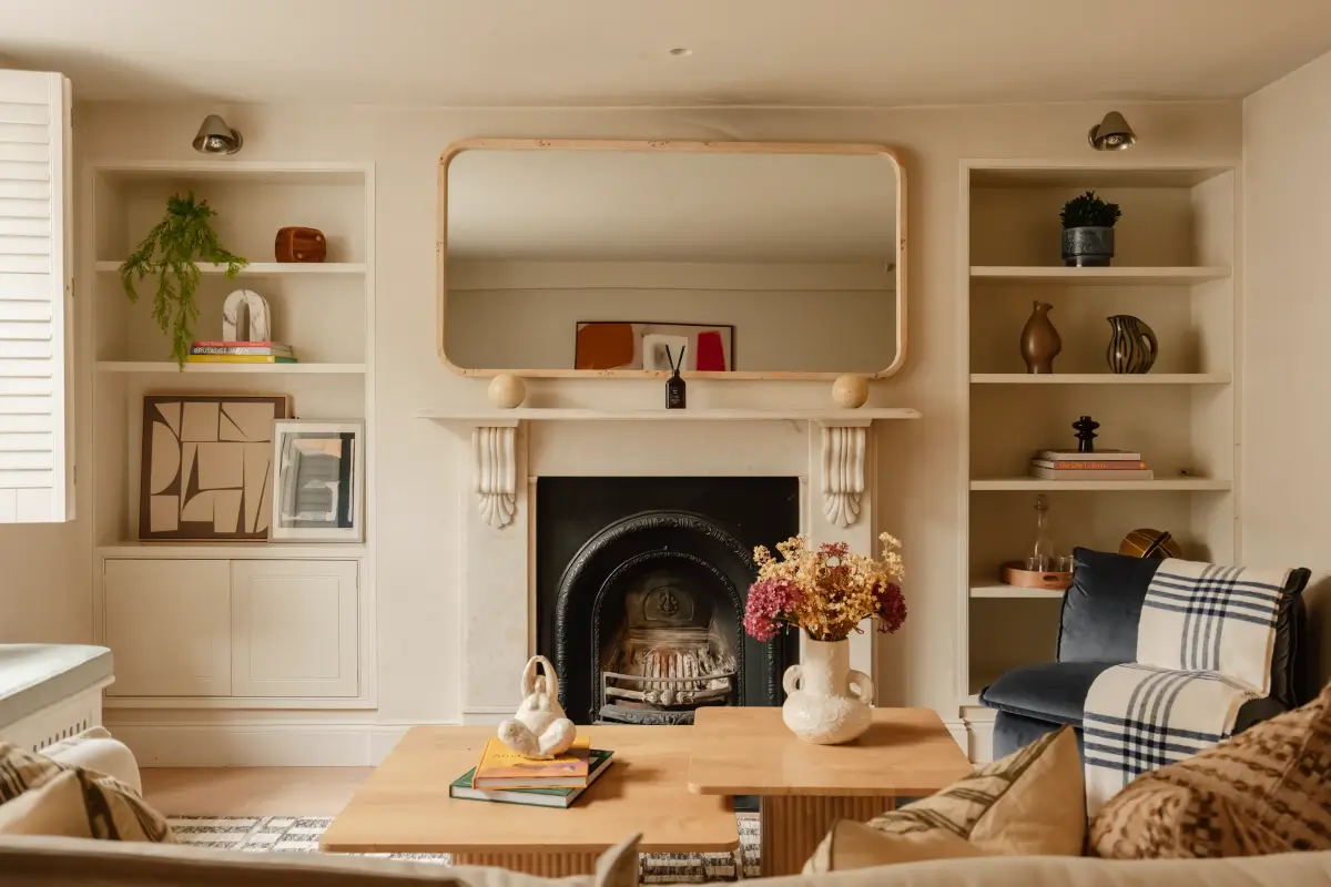 A Serene Duplex Apartment with a Glass Extension in London 1 living room with fireplace flanked by built-in shelves