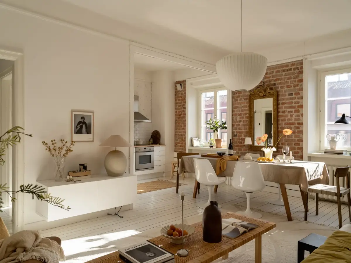 A Fresh 1920s Apartment with White Floorboards and Exposed Brick 1 open-plan living space white floorboards