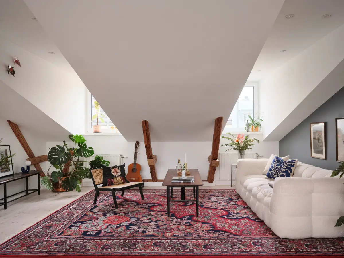 A Modern Attic Apartment with Exposed Beams in a 19th Century Building 1 scandinavian-attic-apartment-wooden-beams-slanted-ceilings-nordroom