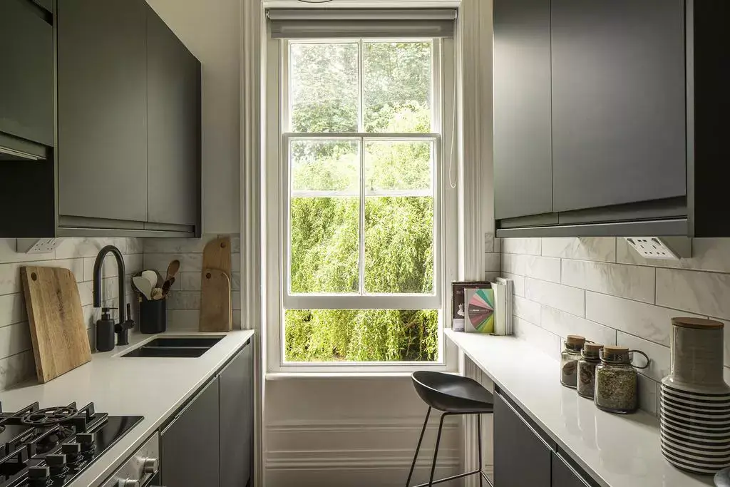 This Retro Color Can Add $2,277 to Your Home's Value (Another Can Cost You $18,000) 6 charcoal gray kitchen cabinets nordroom This Retro Color Can Add $2,277 to Your Home's Value (Another Can Cost You $18,000)