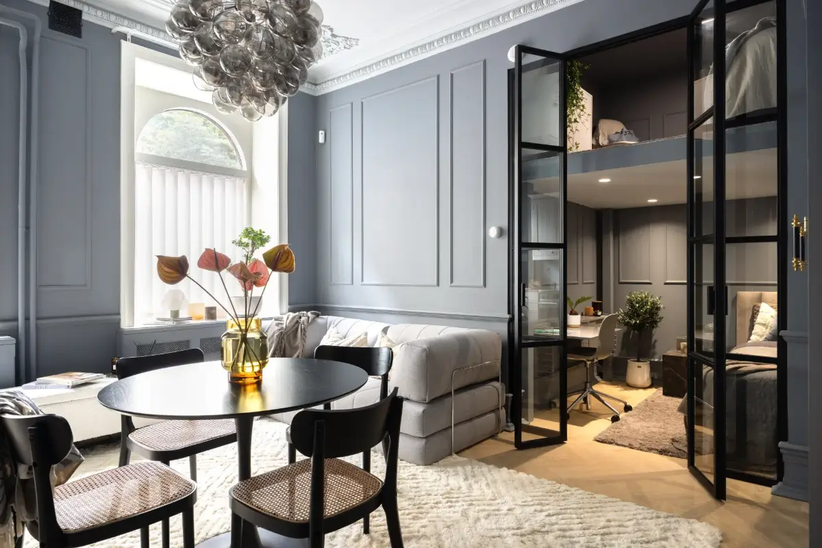 An Industrial Glass Wall Turns a Studio into a One-Bedroom Apartment 10 blue-studio-apartment-industrial-doors-loft-area-nordroom