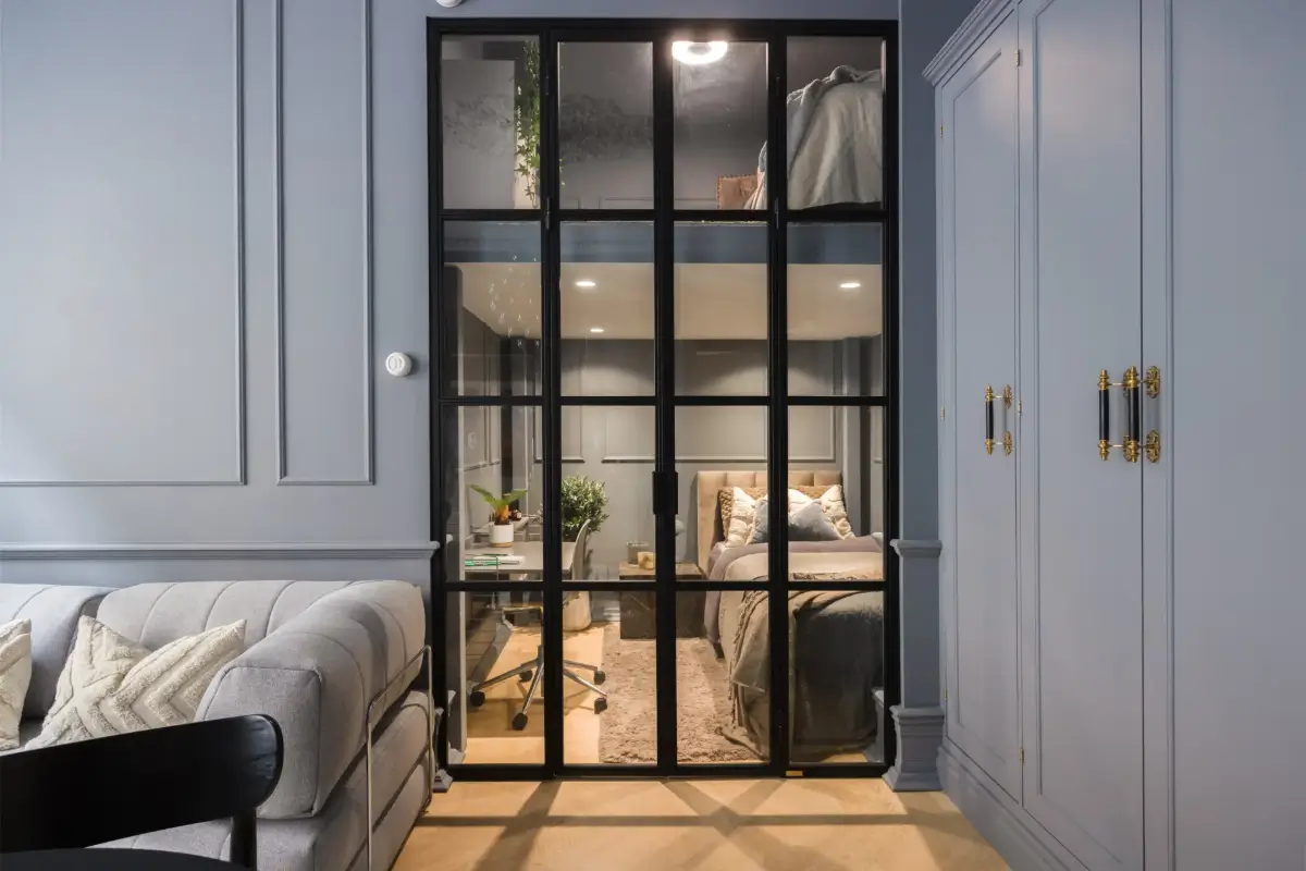 An Industrial Glass Wall Turns a Studio into a One-Bedroom Apartment 20 blue-studio-apartment-industrial-doors-loft-area-nordroom