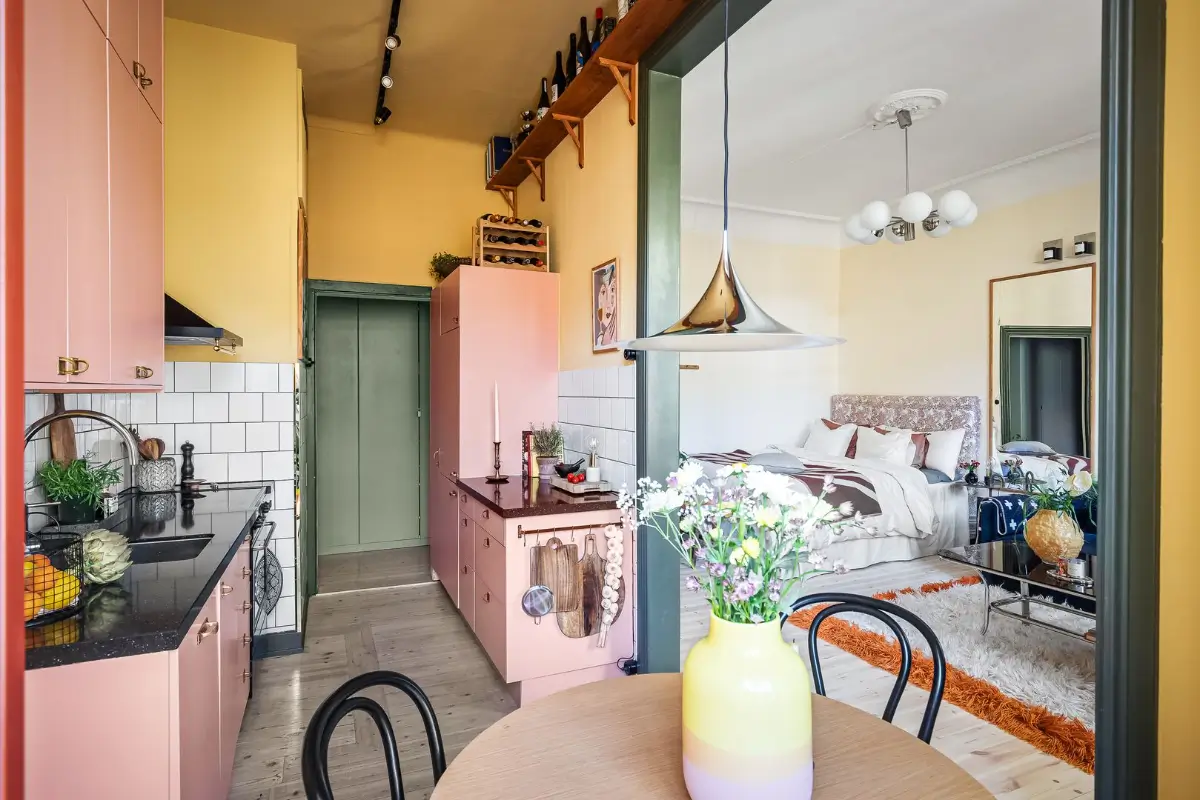 A Pink and Yellow Kitchen in a Colorful Turn-of-the-Century Studio Apartment 14 stockholm-studio-apartment-pink-yellow-kitchen-nordroom