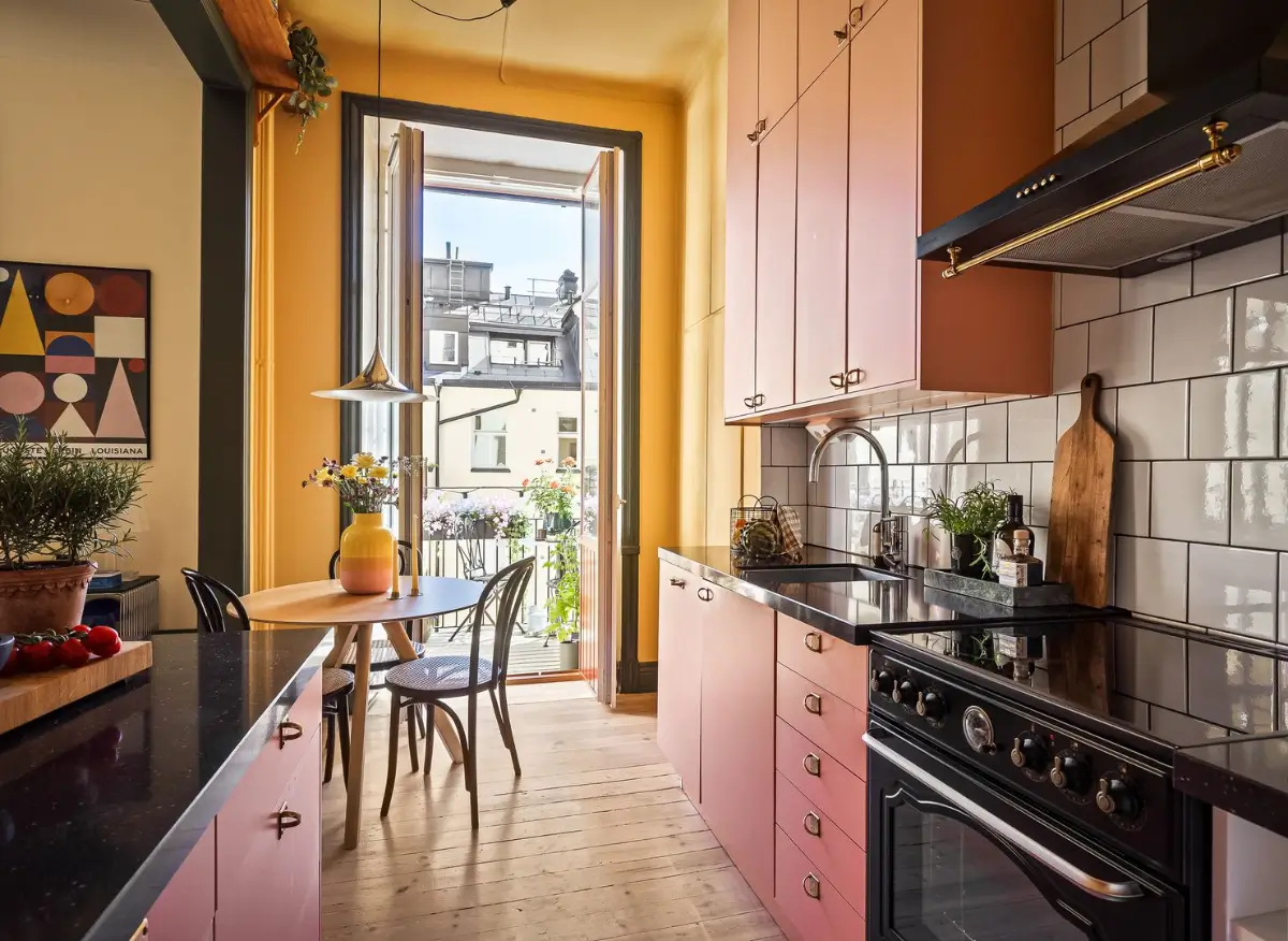 A Pink and Yellow Kitchen in a Colorful Turn-of-the-Century Studio Apartment 7 stockholm-studio-apartment-pink-yellow-kitchen-nordroom