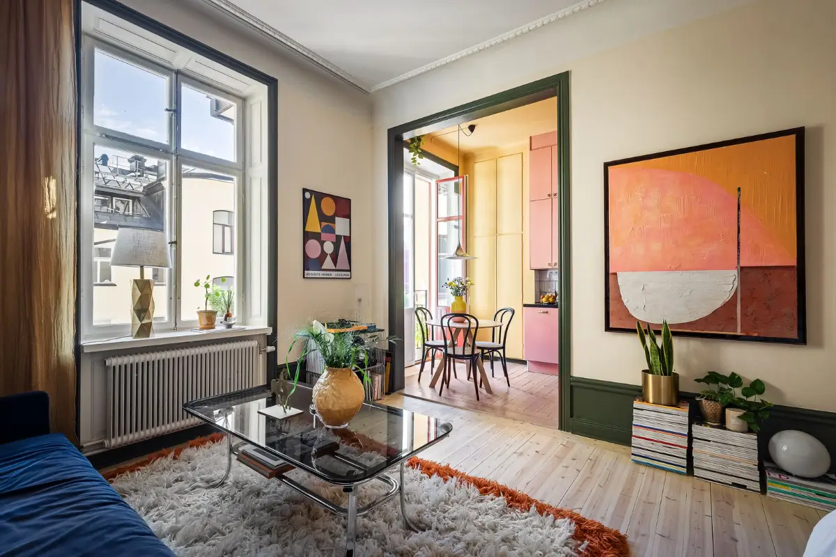 A Pink and Yellow Kitchen in a Colorful Turn-of-the-Century Studio Apartment 1 stockholm-studio-apartment-pink-yellow-kitchen-nordroom