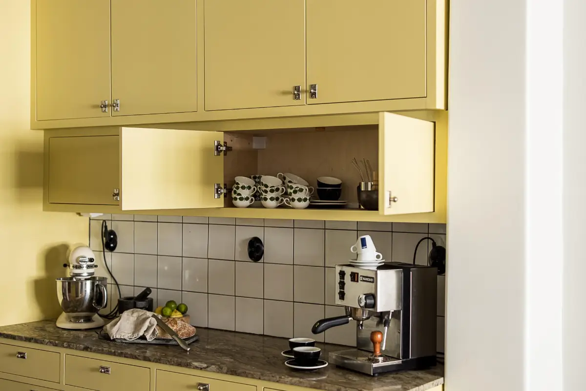 Original Features in a Colorful Midcentury Apartment in Sweden 16 yellow-kitchen-original-features-1940s-apartment-nordroom