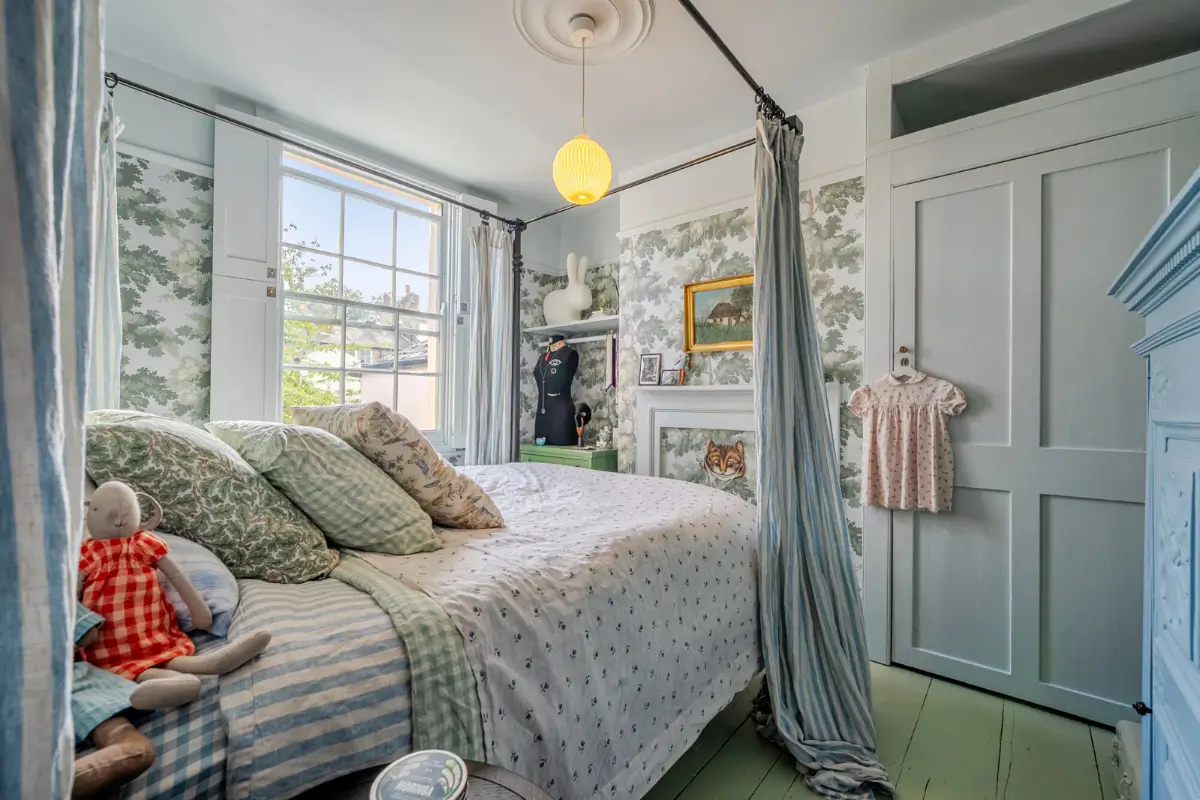 A London Family Home with a Pink deVOL Kitchen and Mint-Green Floorboards 8 bedroom-botanical-wallpaper-built-in-wardrobes