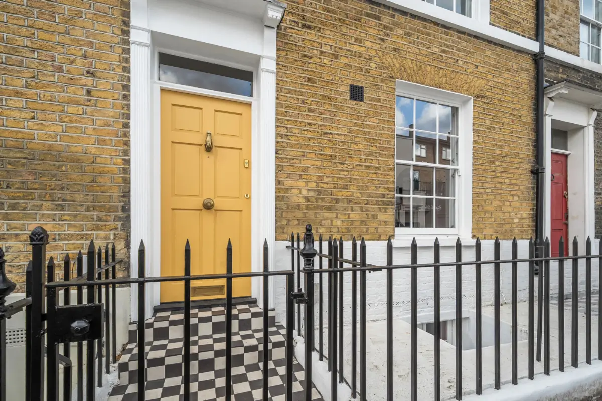 A London Family Home with a Pink deVOL Kitchen and Mint-Green Floorboards 19 checkered-path-yellow-front-door-georgian-house