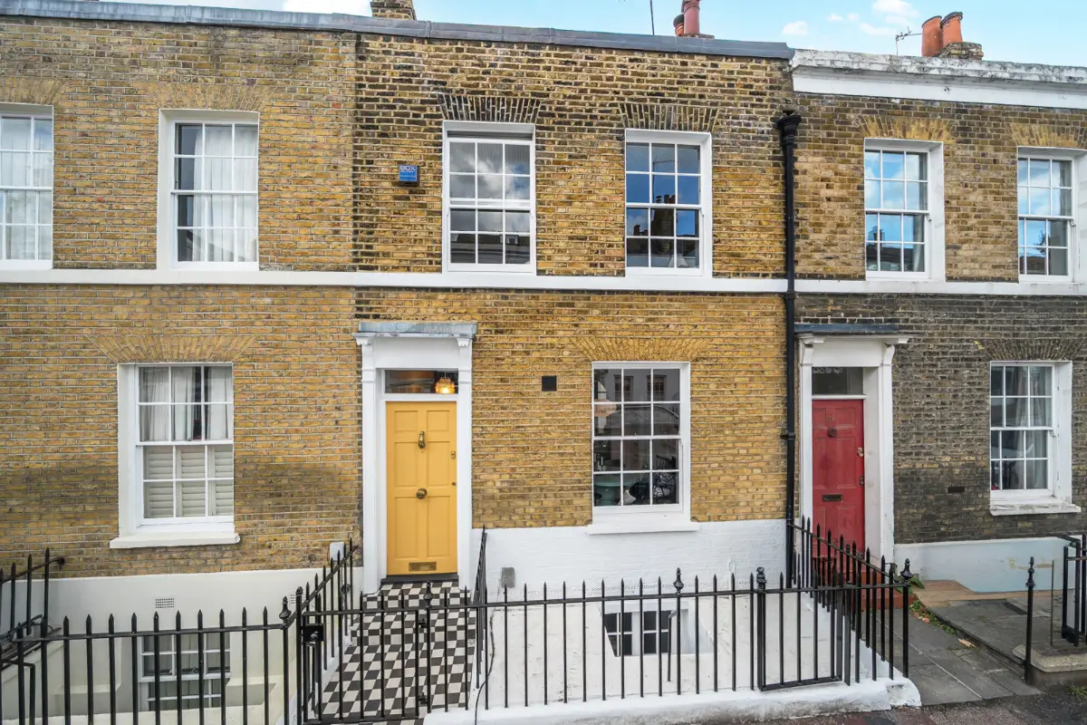 A London Family Home with a Pink deVOL Kitchen and Mint-Green Floorboards 20 yellow-front-door-period-home-london